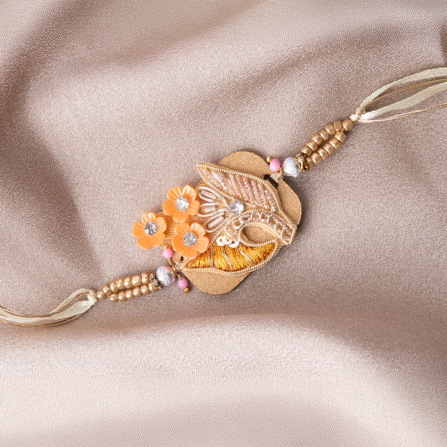 Wooden Base Orange Flower Rakhi With Roli Chawal Set