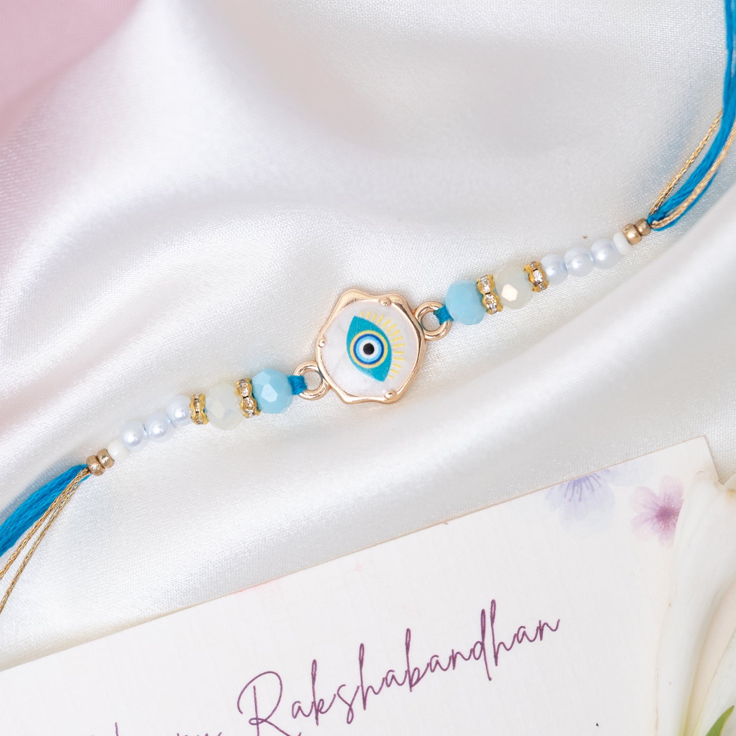 Hand Painted Blue Evil Eye Marble Rakhi With Pearls With Roli Chawal Set
