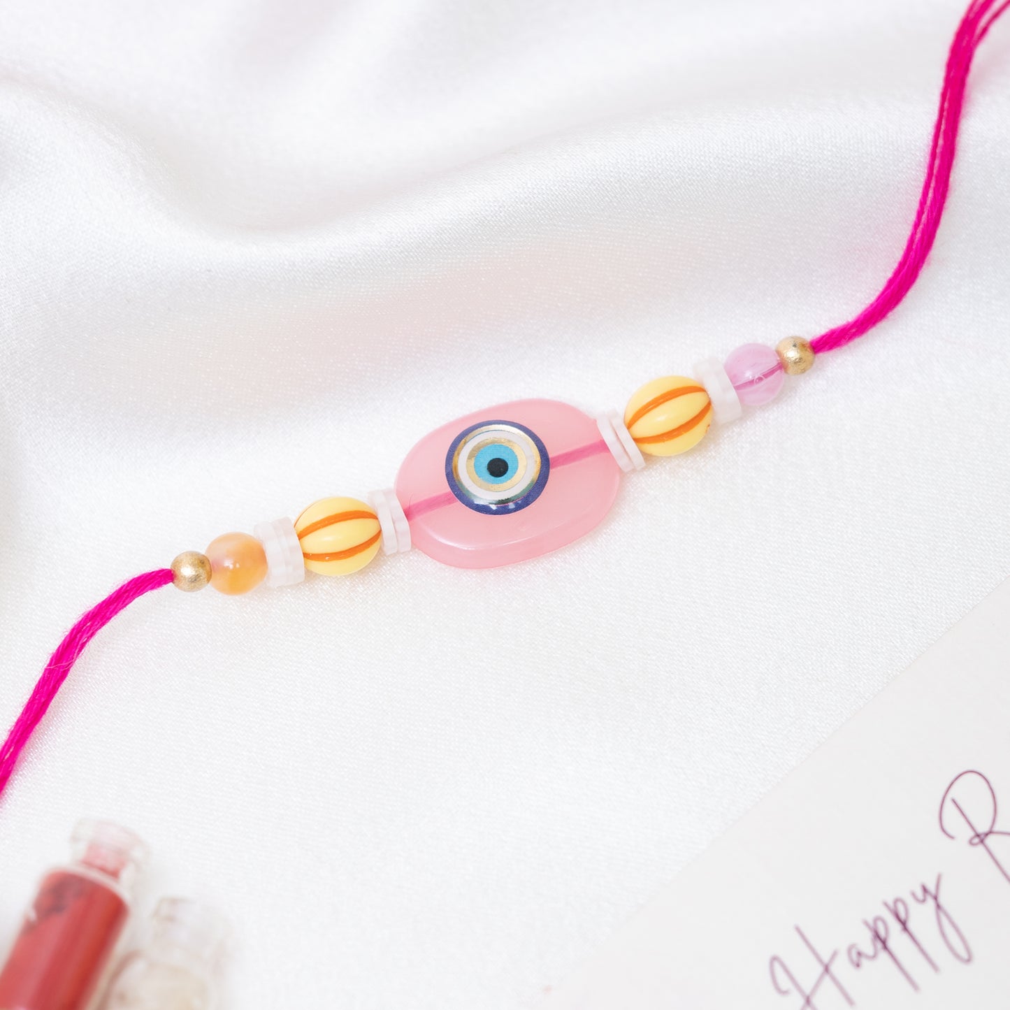 Quirky Evil Eye Resin Rakhi. Set of 2 With Roli Chawal Set
