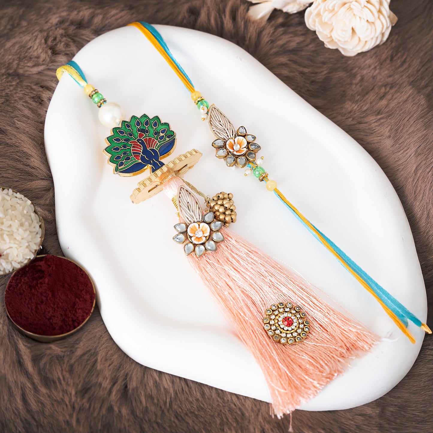 Royal Rakhi Set with Peacock Motif & Rich Tassels contains roli Chawal set