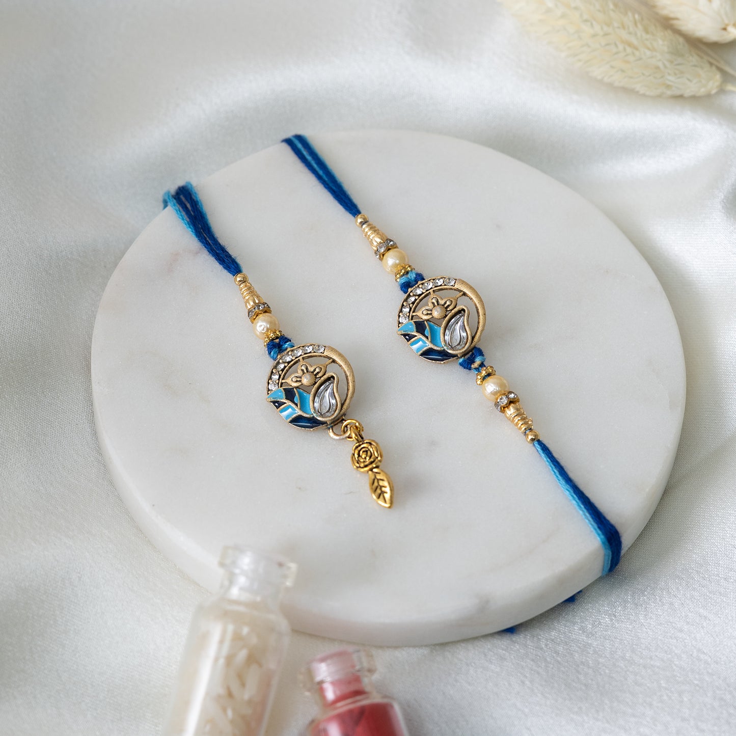Chic Blue Leaf Rakhi Set for Him & Her With Roli Chawal Set