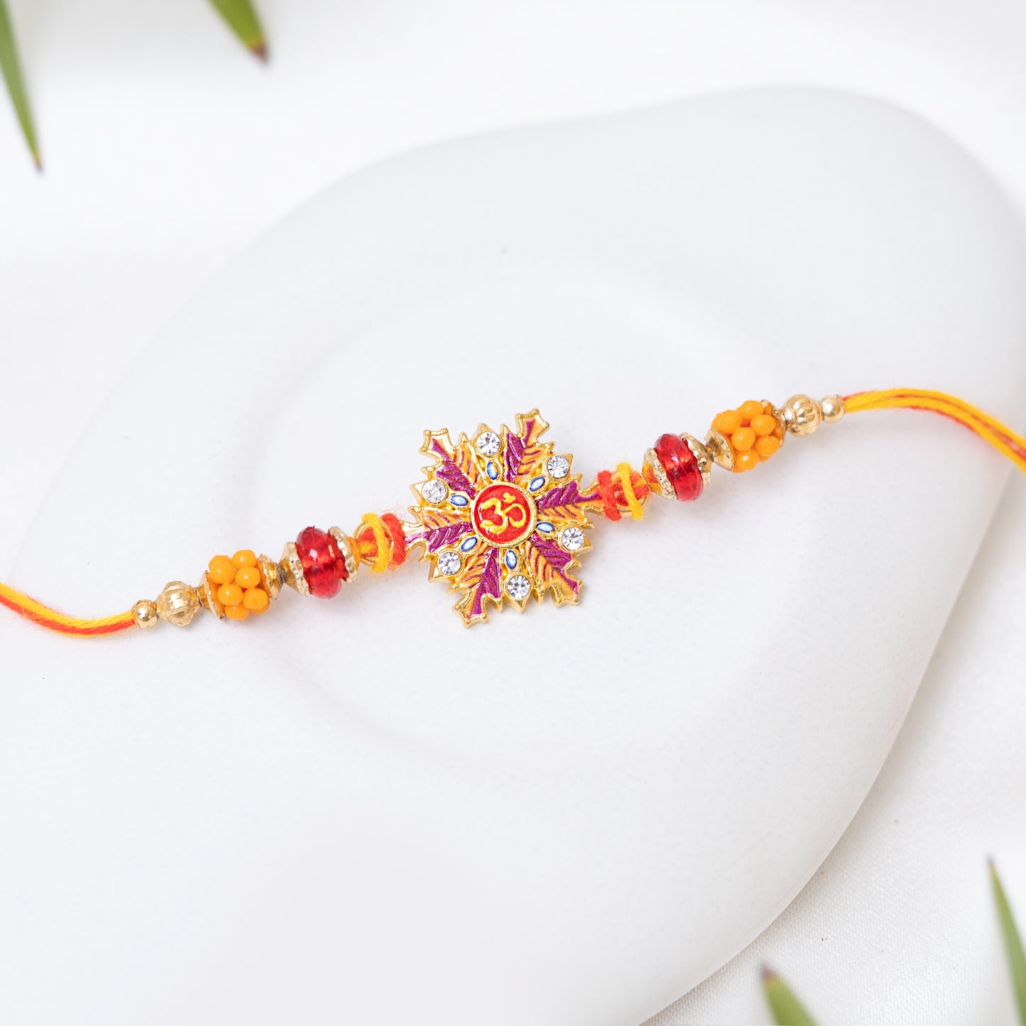 Om Adorned Metal Rakhi with Roli Chawal Set