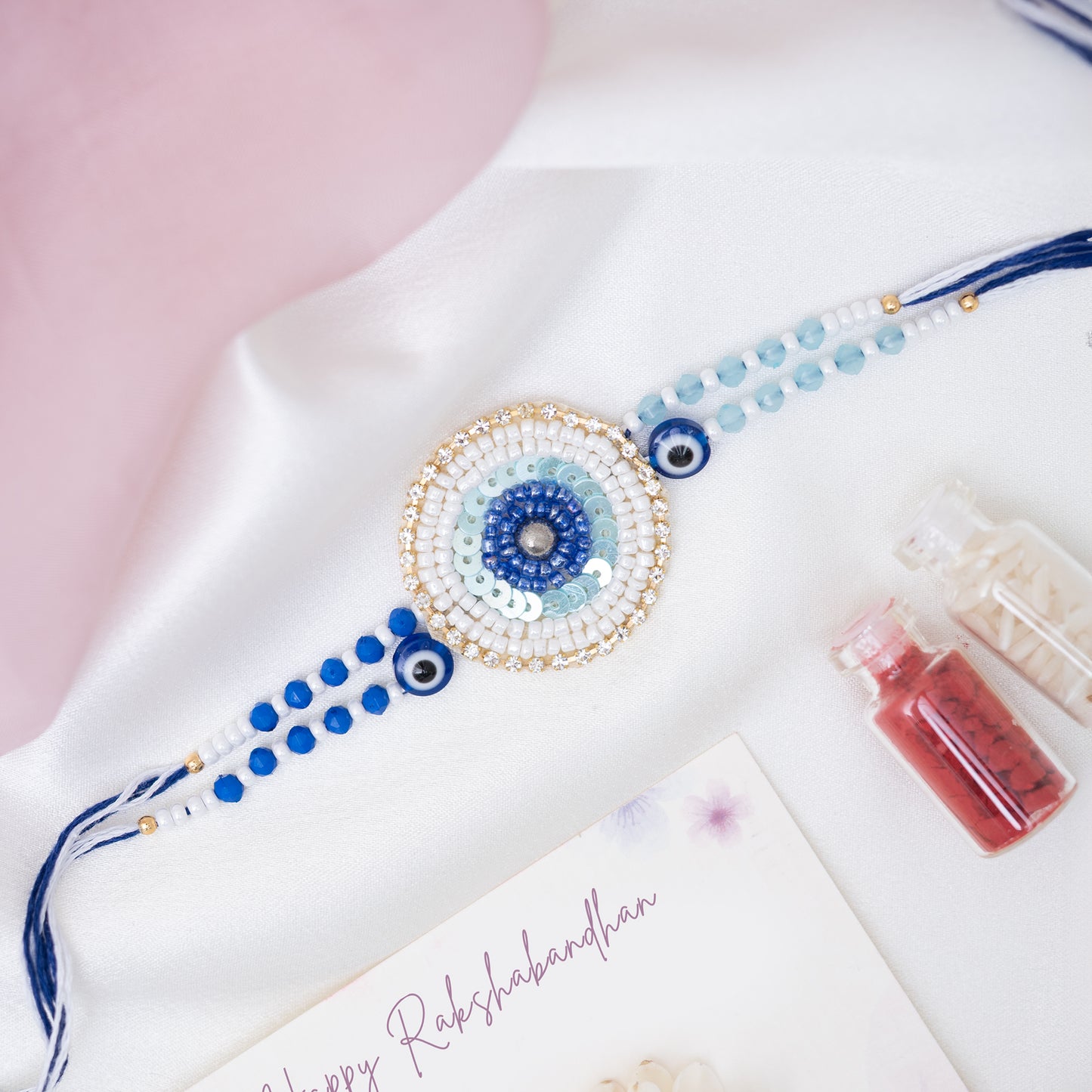 Handmade Evil Eye Pearl Rakhi With Roli Chawal Set
