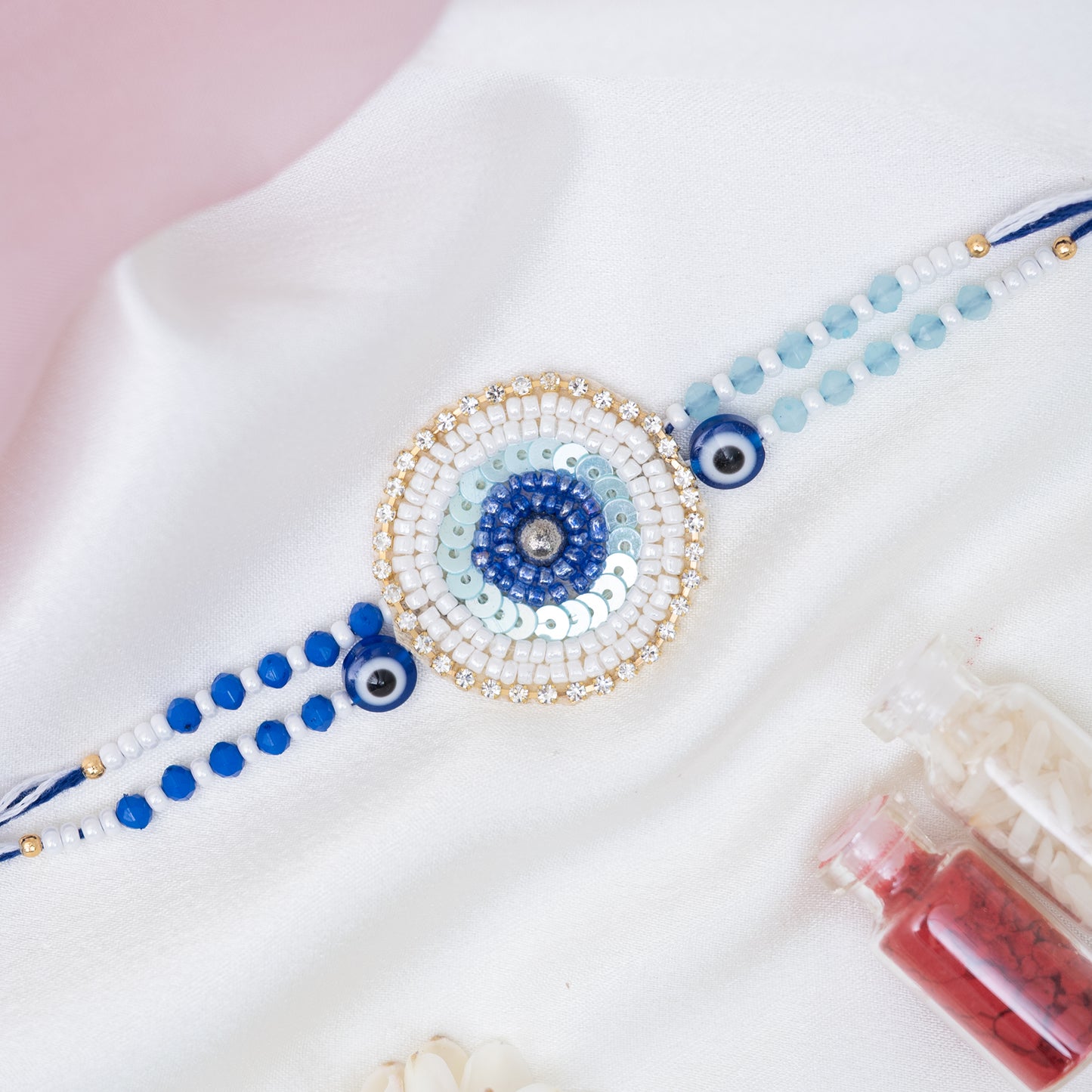 Handmade Evil Eye Pearl Rakhi With Roli Chawal Set
