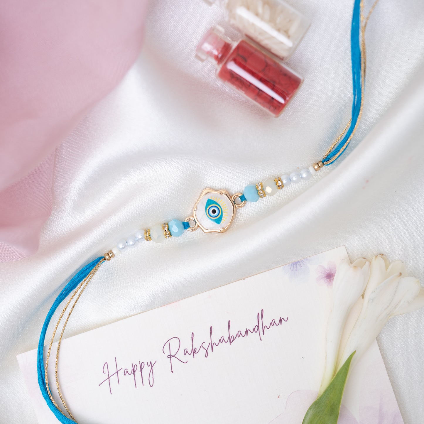 Hand Painted Blue Evil Eye Marble Rakhi With Pearls With Roli Chawal Set