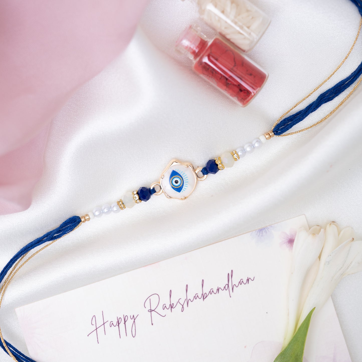 Royal Blue Evil Eye Marble Rakhi With Pearls With Roli Chawal Set