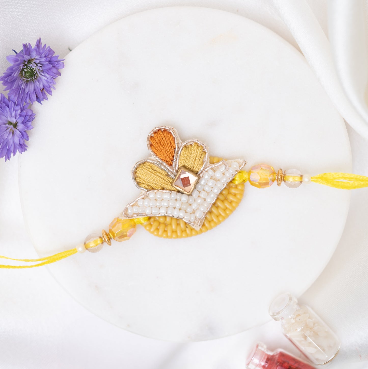 Handcrafted Flower Pearl Rakhi wth Roli Chawal Set