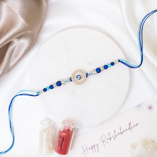 Evil Eye Metal Disc Rakhi With Roli Chawal Set