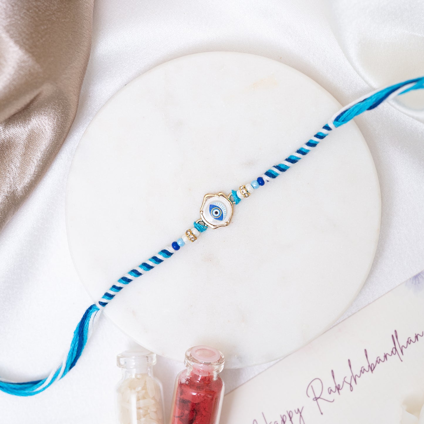 Marble Glow Evil Eye braided Rakhi With Roli Chawal Set