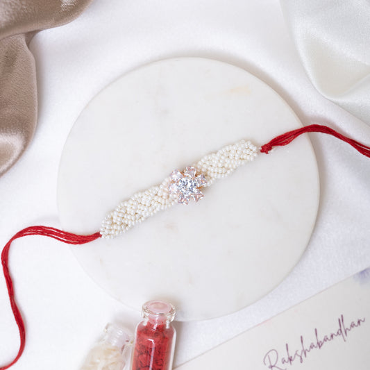 Pearl Twist with Floral Shine Rakhi With Roli Chawal Set