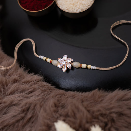 Crystal Blossom Rakhi in Beige Color With Roli Chawal Set