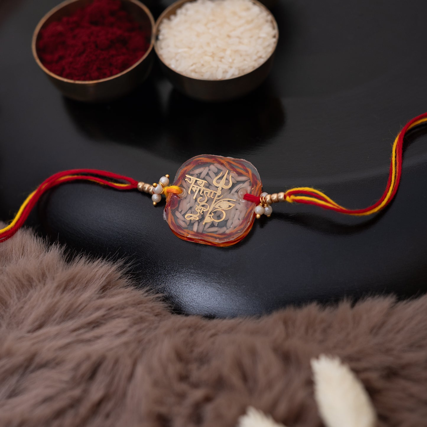 Mauli Rice Jai Mata Di Resin rakhi with set of Roli Chawal