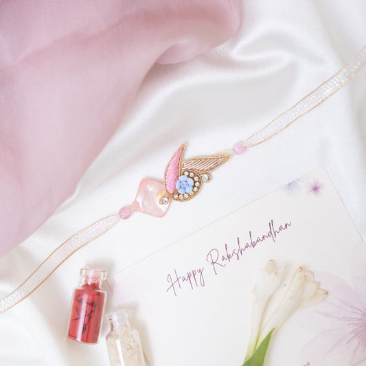 Designer rakhi in soft pink with roli chawal set