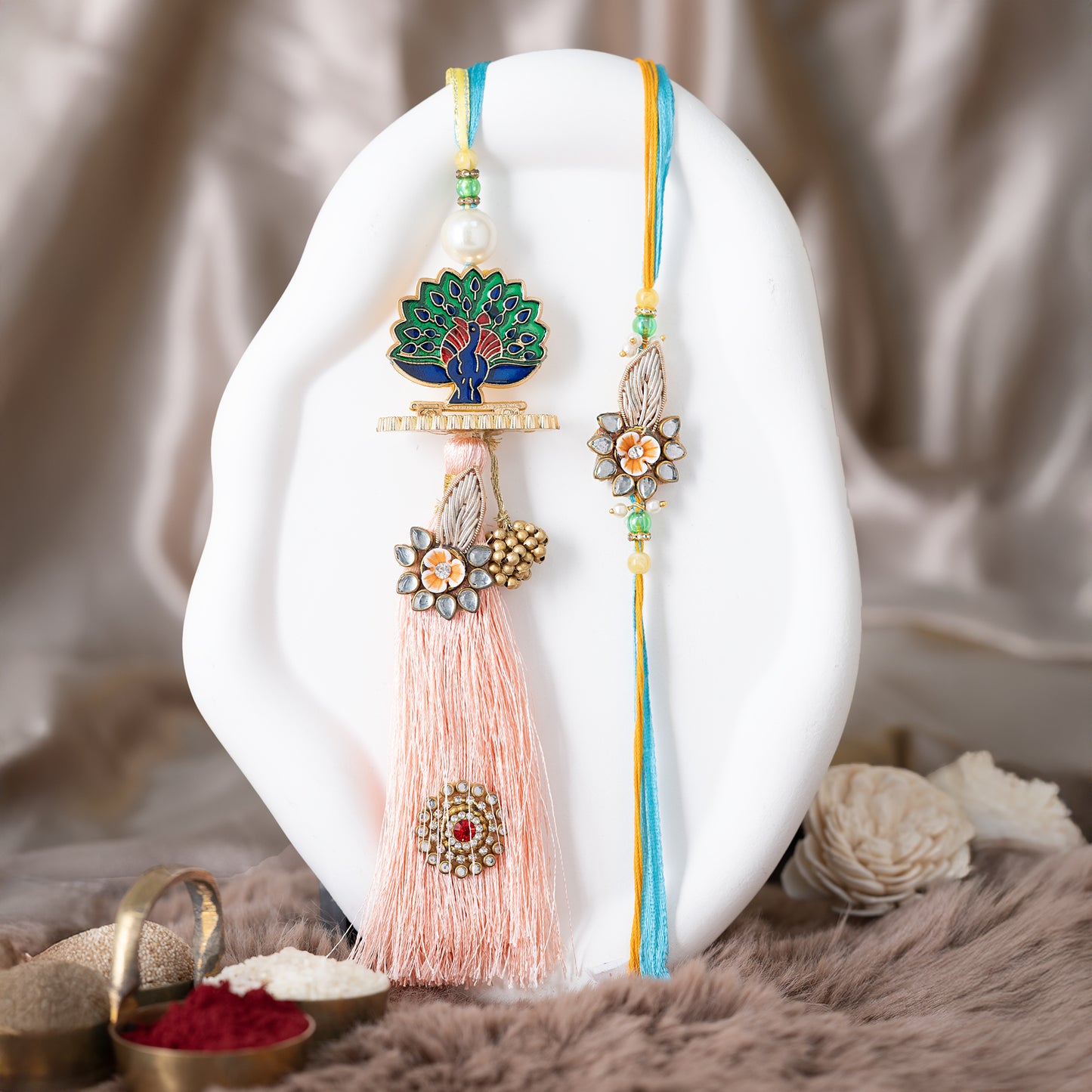 Royal Rakhi Set with Peacock Motif & Rich Tassels contains roli Chawal set