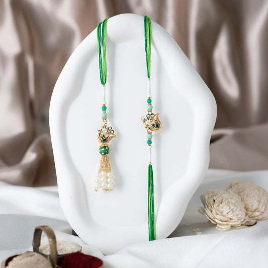 Regal Bhai-Bhabhi Peacock Rakhi Pair with Luxury Tassels With Roli Chawal Set