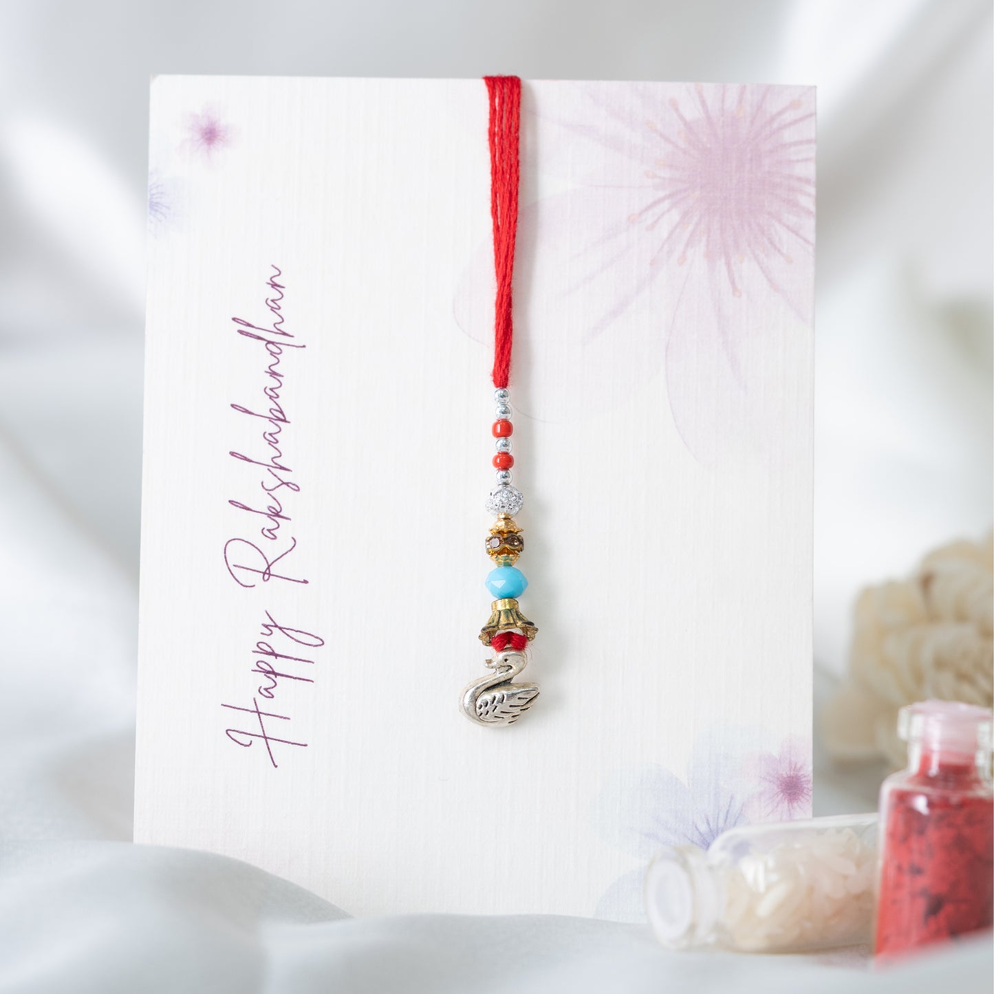 Minimal Swan Charm Lumba With Roli Chawal Set