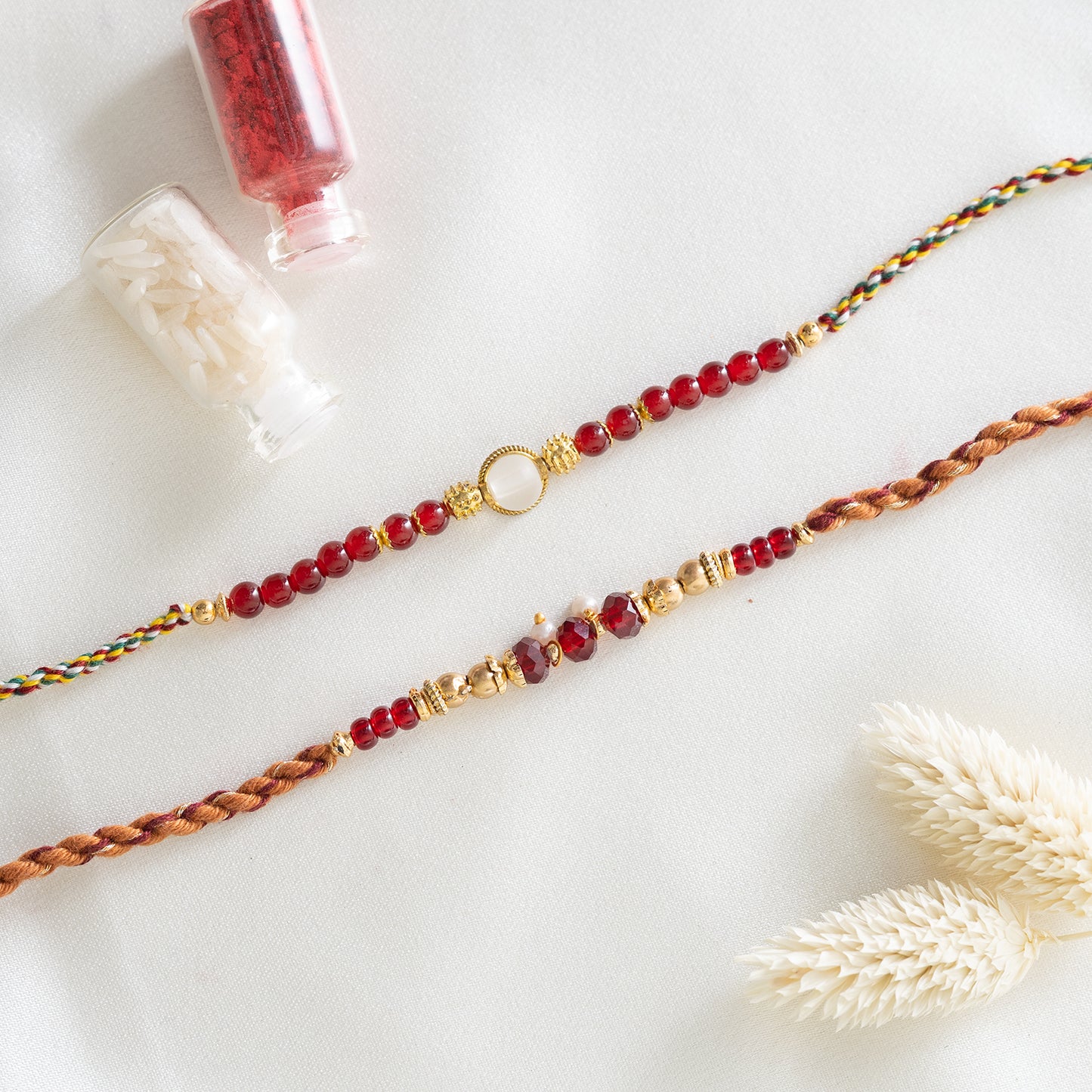 Set of 2 Red Beaded Rakhi With Roli Chawal Set