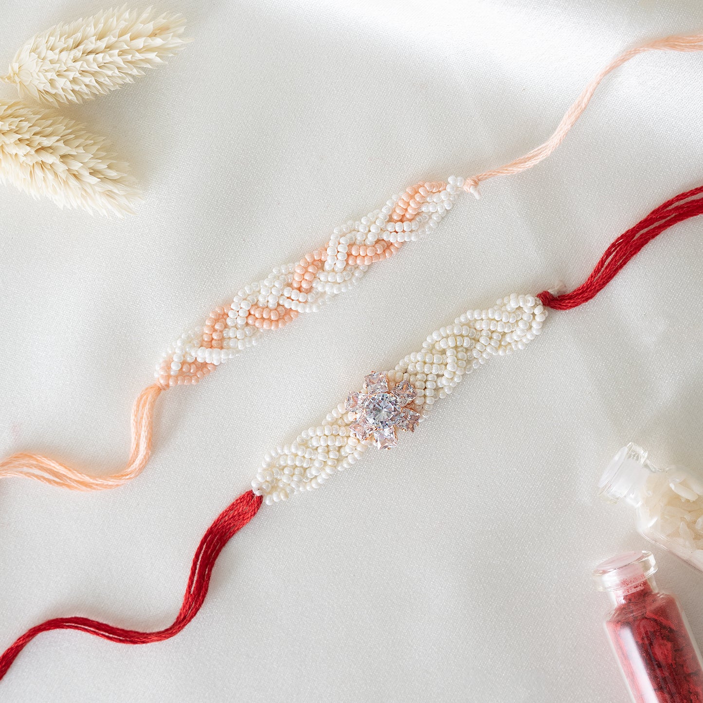 Braided Pearl Rakhi. Set of 2 With Roli Chawal Set