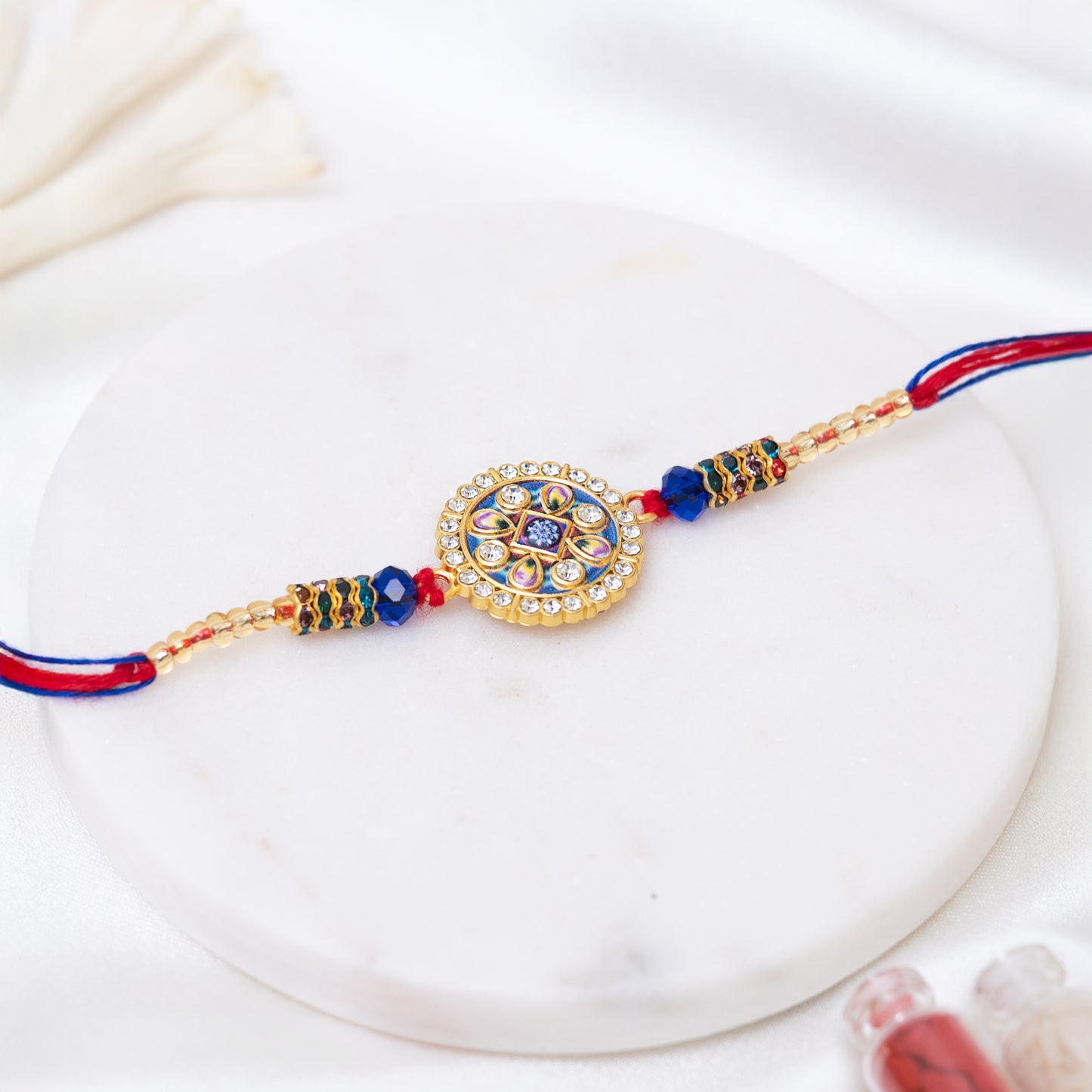 Stone Studded Metal Rakhi. Set of 2 With Roli Chawal Set