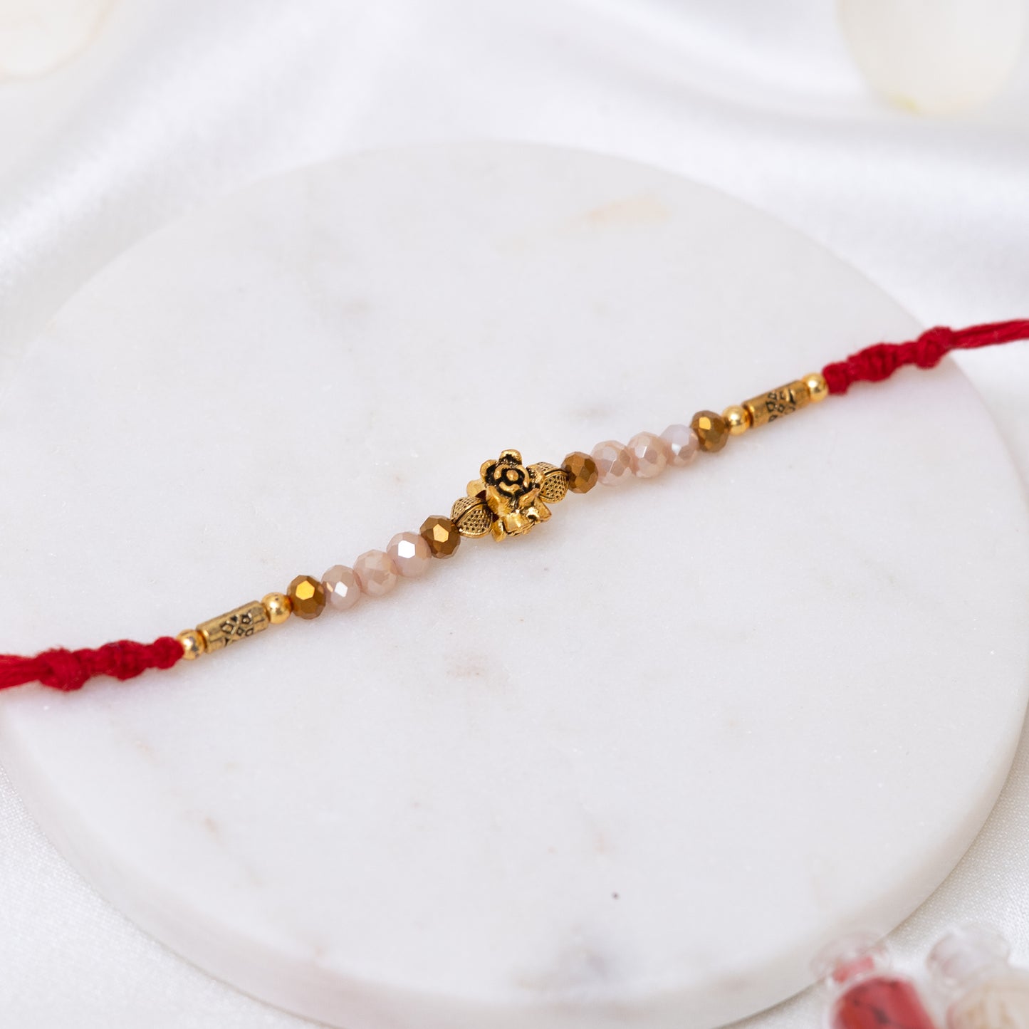 Minimal Antique Gold Rakhi with Pastel Beads with Roli Chawal Set