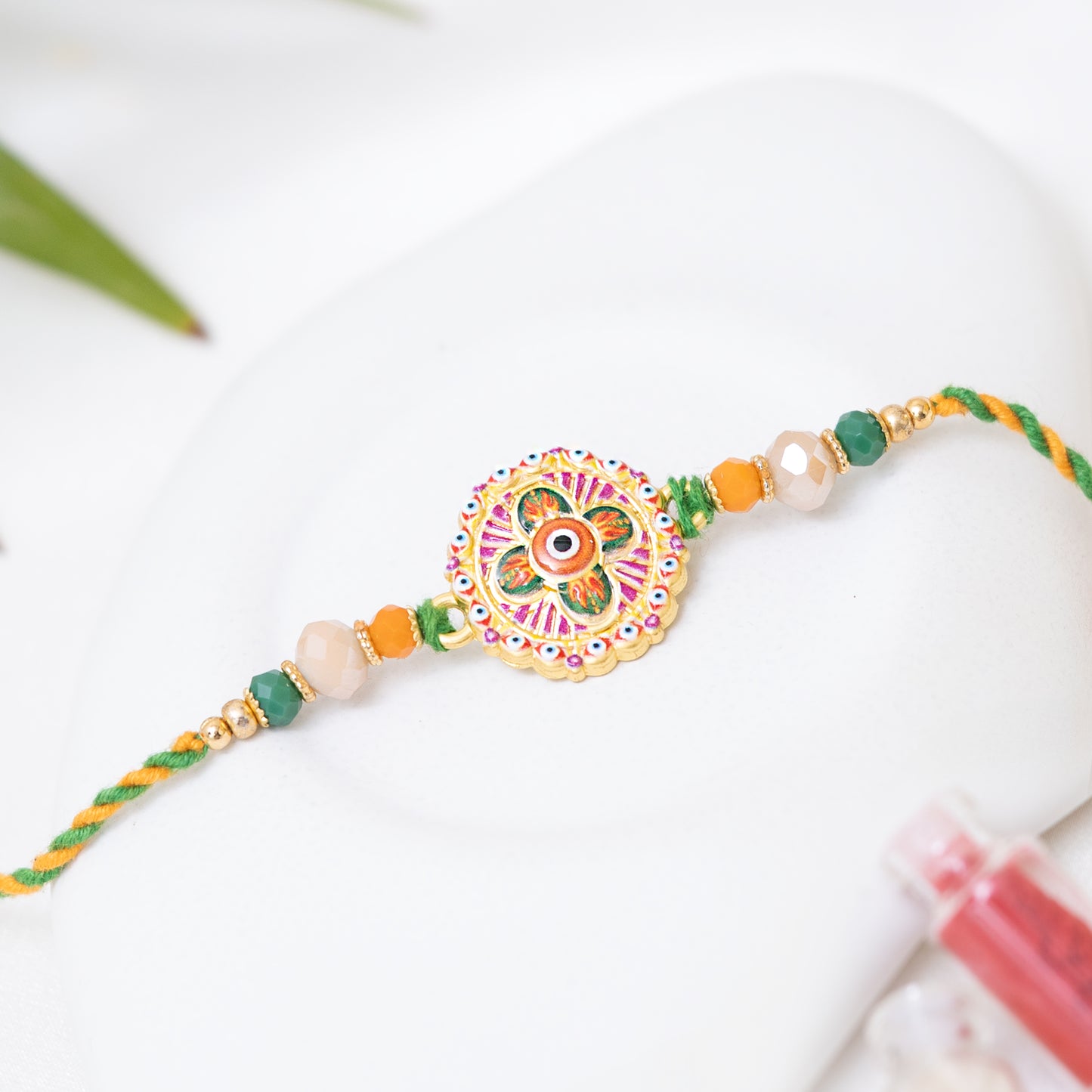 Traditional Karigari Evil Eye Rakhi. Set of 2 With Roli Chawal Set