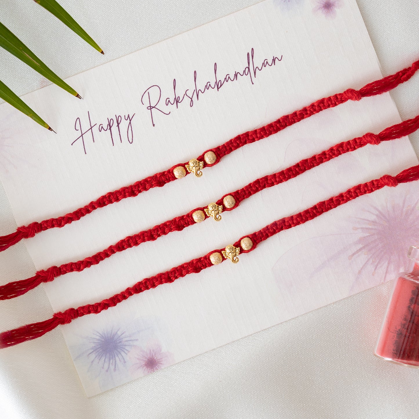 Mini Ganesha Charm Bhai rakhi Set of 3 With Roli Chawal Set