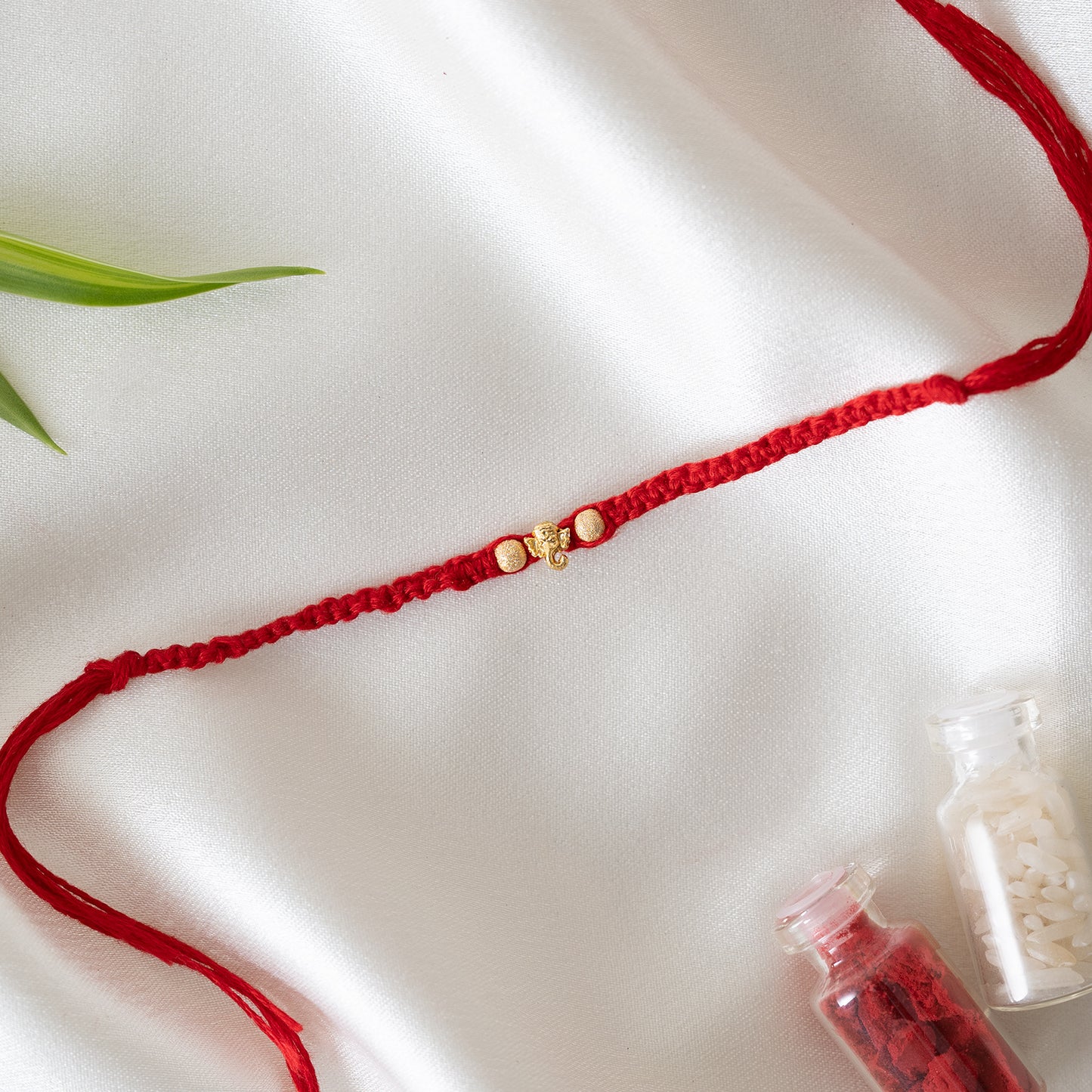 Mini Ganesha Charm Bhai rakhi Set of 3 With Roli Chawal Set