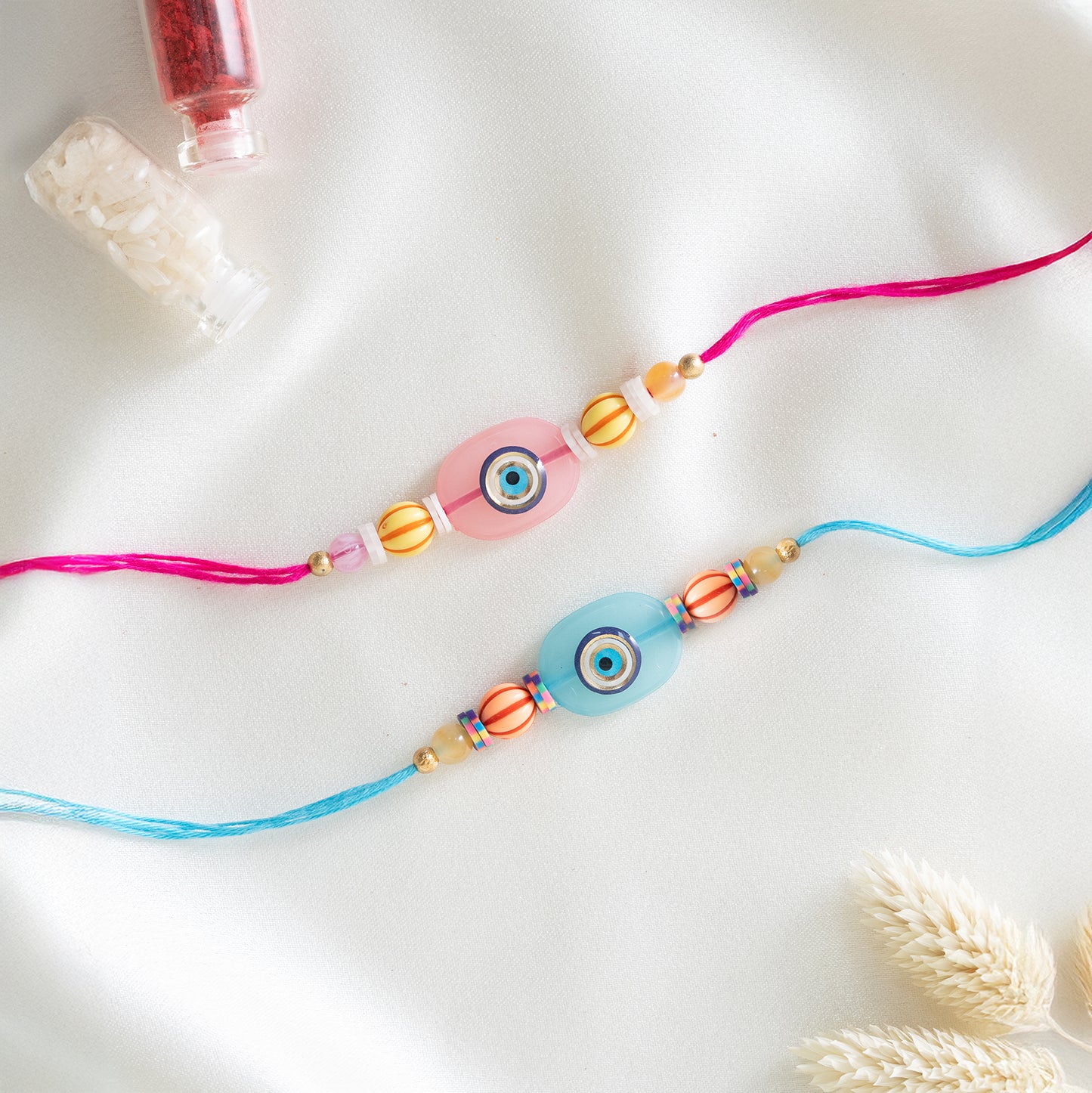 Quirky Evil Eye Resin Rakhi. Set of 2 With Roli Chawal Set